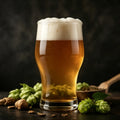 1:1 dark studio photo of golden frothy wheat beer glass, fresh hops and malt grains on dark wood, SEVVS home brewing scene